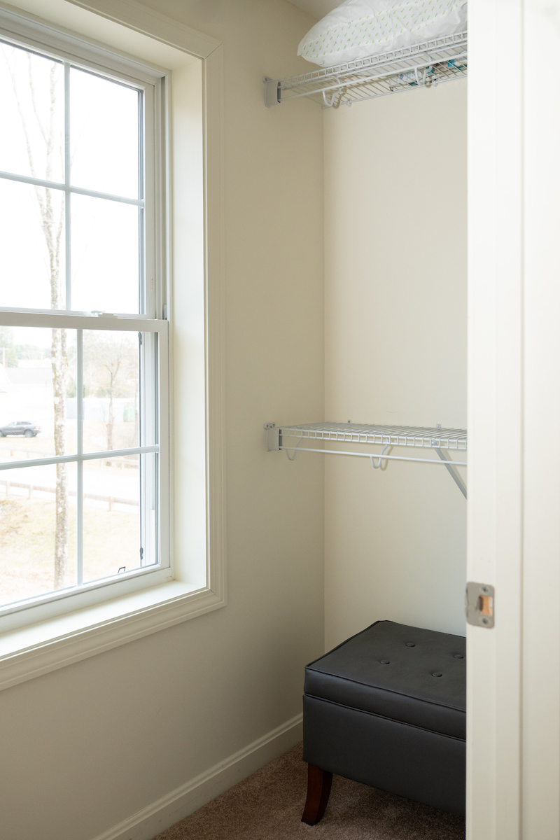 Bedroom 1 Walk-In Closet of a 3 Bedroom Unit in the Evergreen Way Community, a high-end townhouse community by Socha Companies in Manchester NH