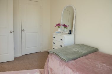 Bedroom 2 of a 3 Bedroom Unit in the Evergreen Way Community, a high-end townhouse community by Socha Companies in Manchester NH